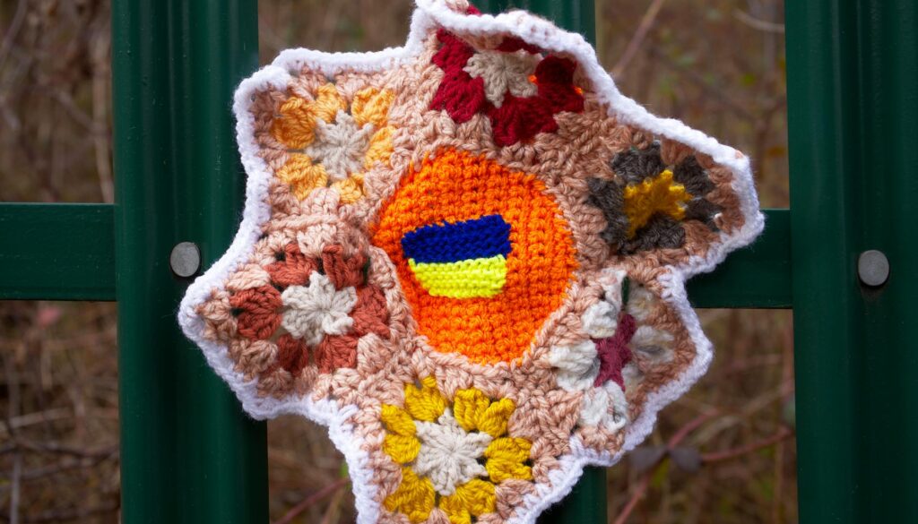 knitted decoration on fence