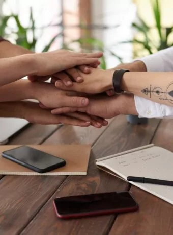 photo of people near wooden table