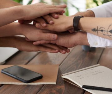 photo of people near wooden table