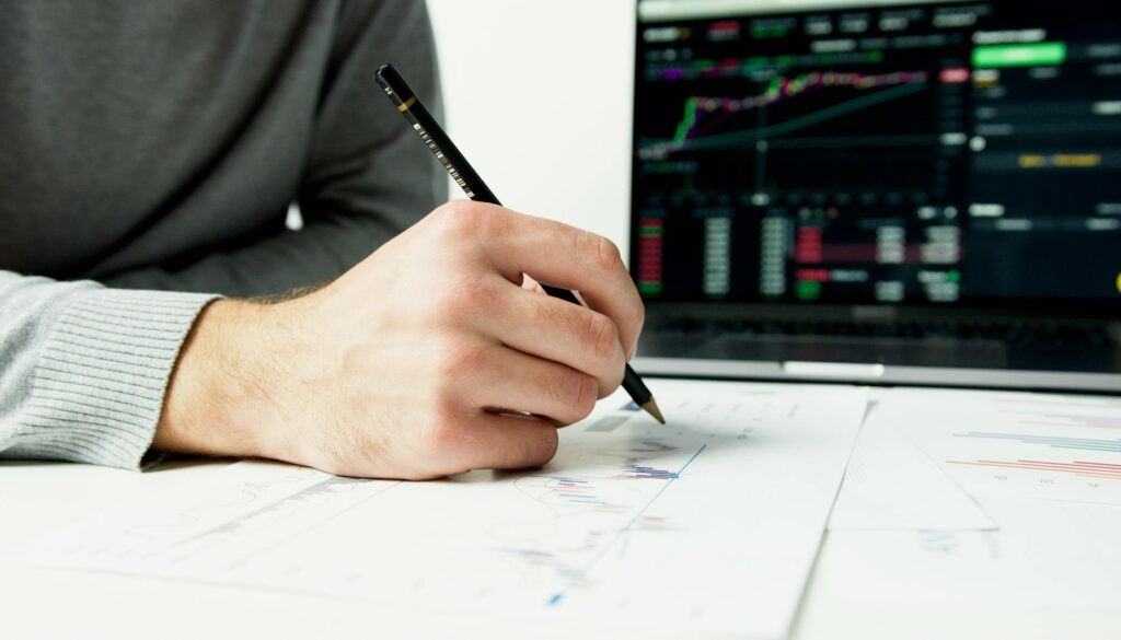 person writing on white paper