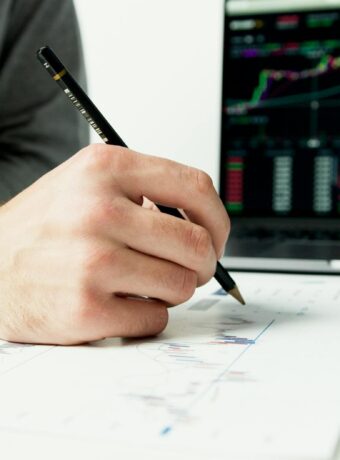 person writing on white paper