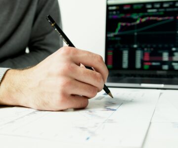 person writing on white paper