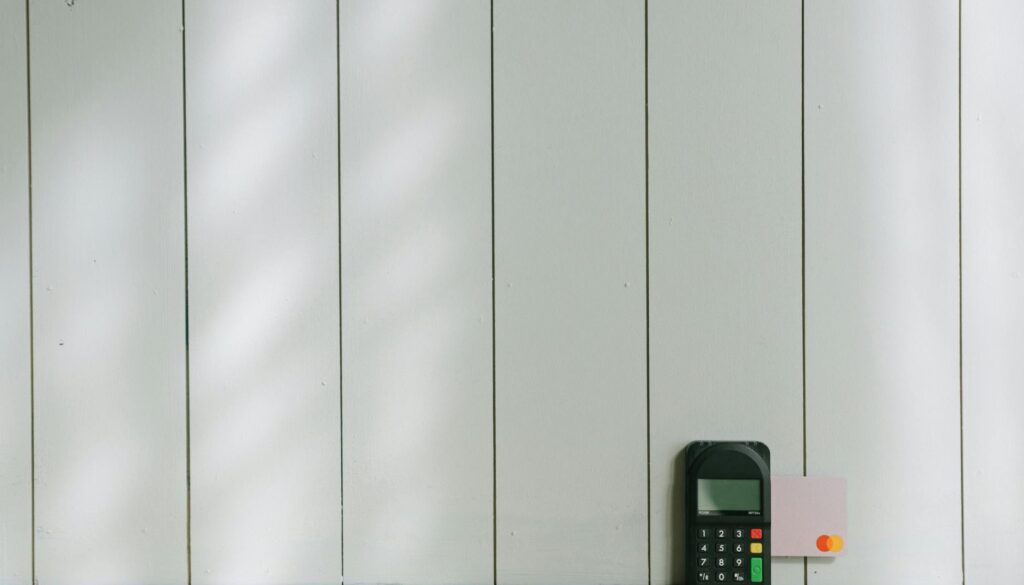 black and gray digital device on brown wooden table
