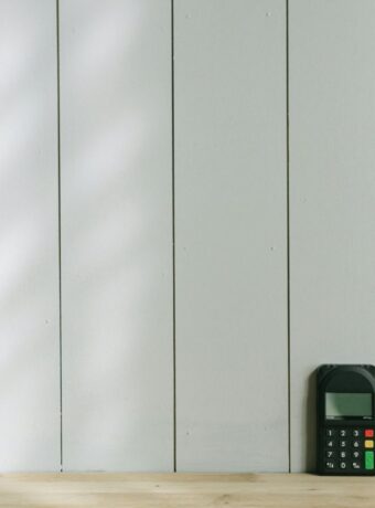 black and gray digital device on brown wooden table
