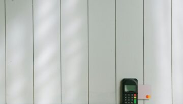 black and gray digital device on brown wooden table