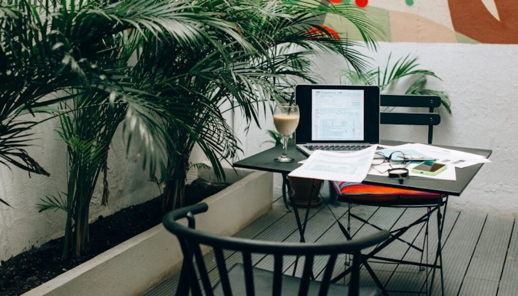 black laptop computer on white table